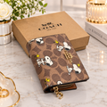 Coach X Peanuts Snap Wallet In Signature Canvas With Snoopy Print CBN32
